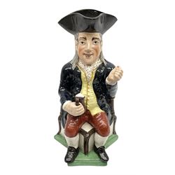 Early 20th century Staffordshire William Kent Squire toby jug, modelled seated upon a corner chair holding a jug of ale in his right hand, H28cm