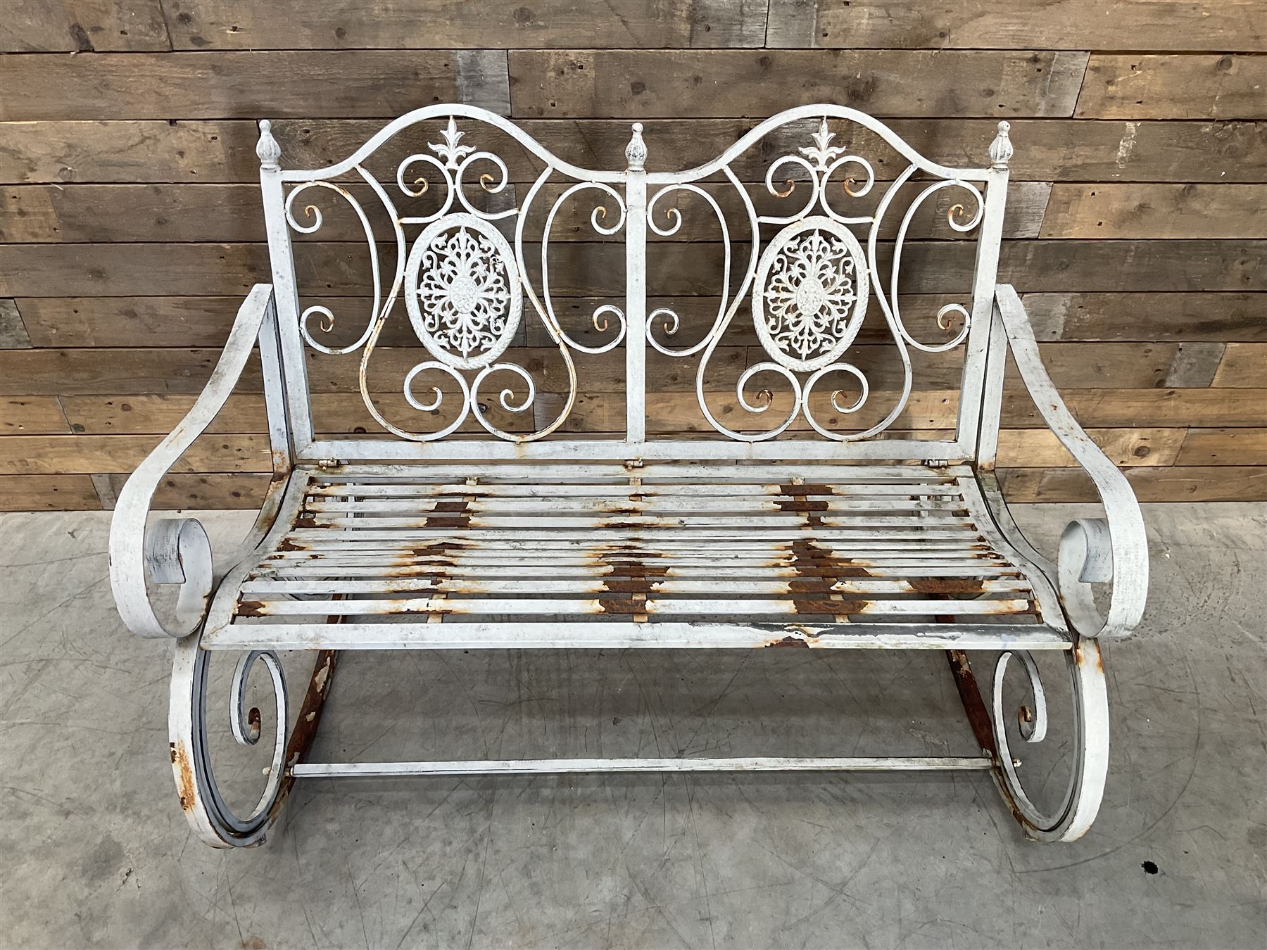 Wrought metal rocking garden bench seat, in antique grey finish
