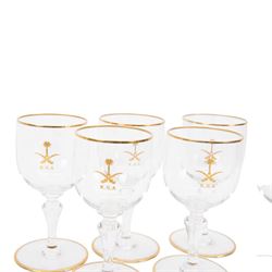 Baccarat decanter, six wine glass and six port glasses,  all with a gilt band to the rim and foot and motif for Kingdom of Saudi Arabia