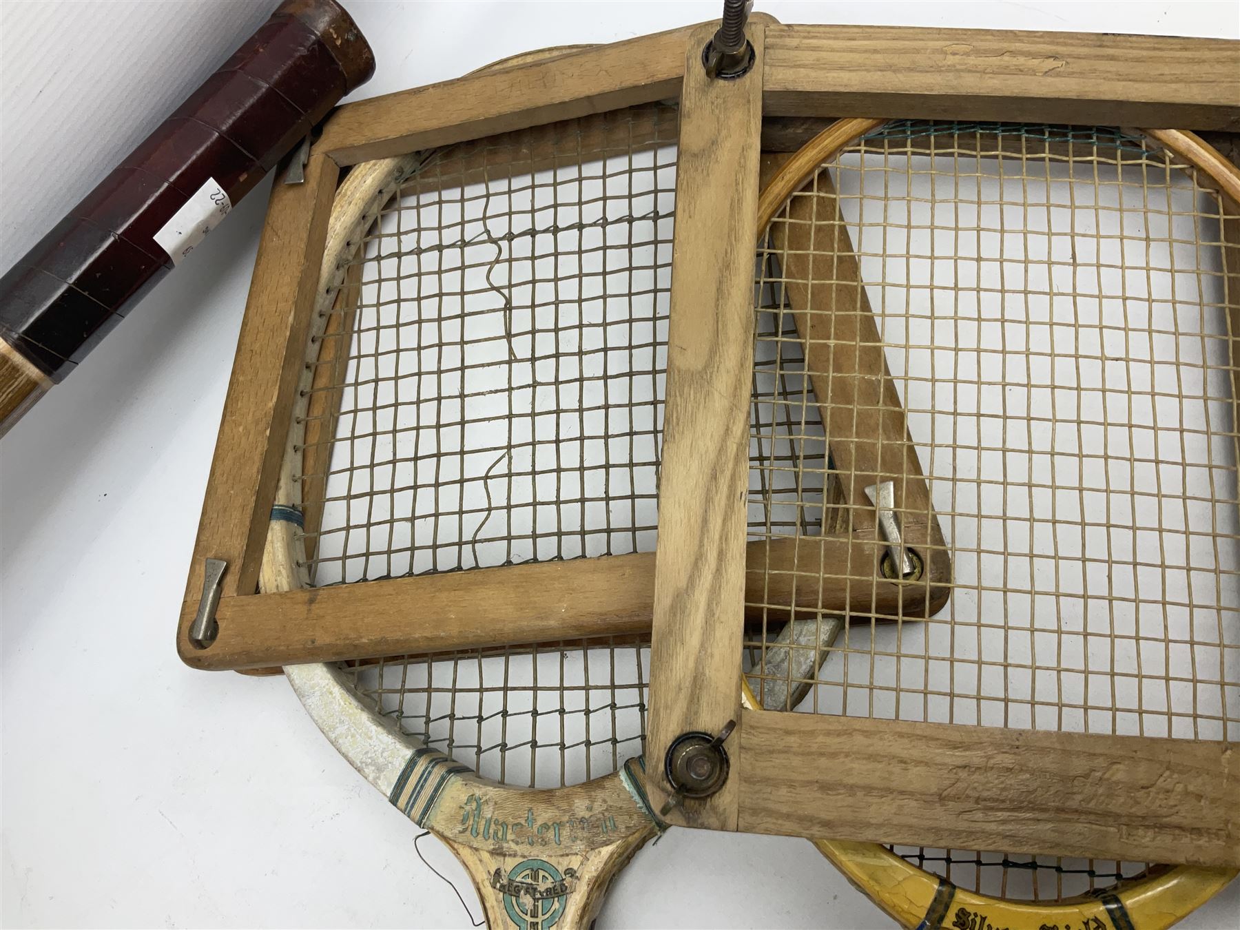 Quantity of early 20th century and later tennis rackets, to include Artus Majesty, Dunlop Alpha, Atlas Silver Shield and Raleigh Konni, together with a stitched rugby ball