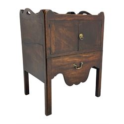 George III mahogany night commode, tray top with raised sides pierced with handles, fitted with cupboard over pull-out commode, shaped apron, on square moulded supports