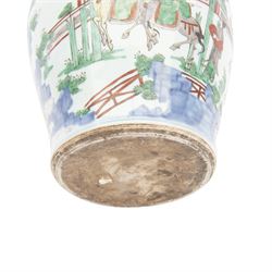 17th century Transitional period Chinese Wucai vase and cover, of baluster form, the body painted with ladies upon a terrace, and figures upon horseback and attendants within a fenced garden, the domed cover with knop finial painted with boys at play, H37cm
