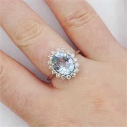 18ct white gold oval cut aquamarine and round brilliant cut diamond cluster ring, aquamarine approx 2.15 carat, total diamond weight approx 0.50 carat