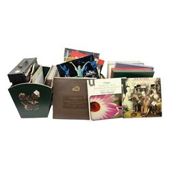 Wooden magazine rack, with floral detail, together with a collection of records, to include the box sets 'the Story of Great Music', 'Popmobility', Happy Holiday in Greece  etc, in three boxes 