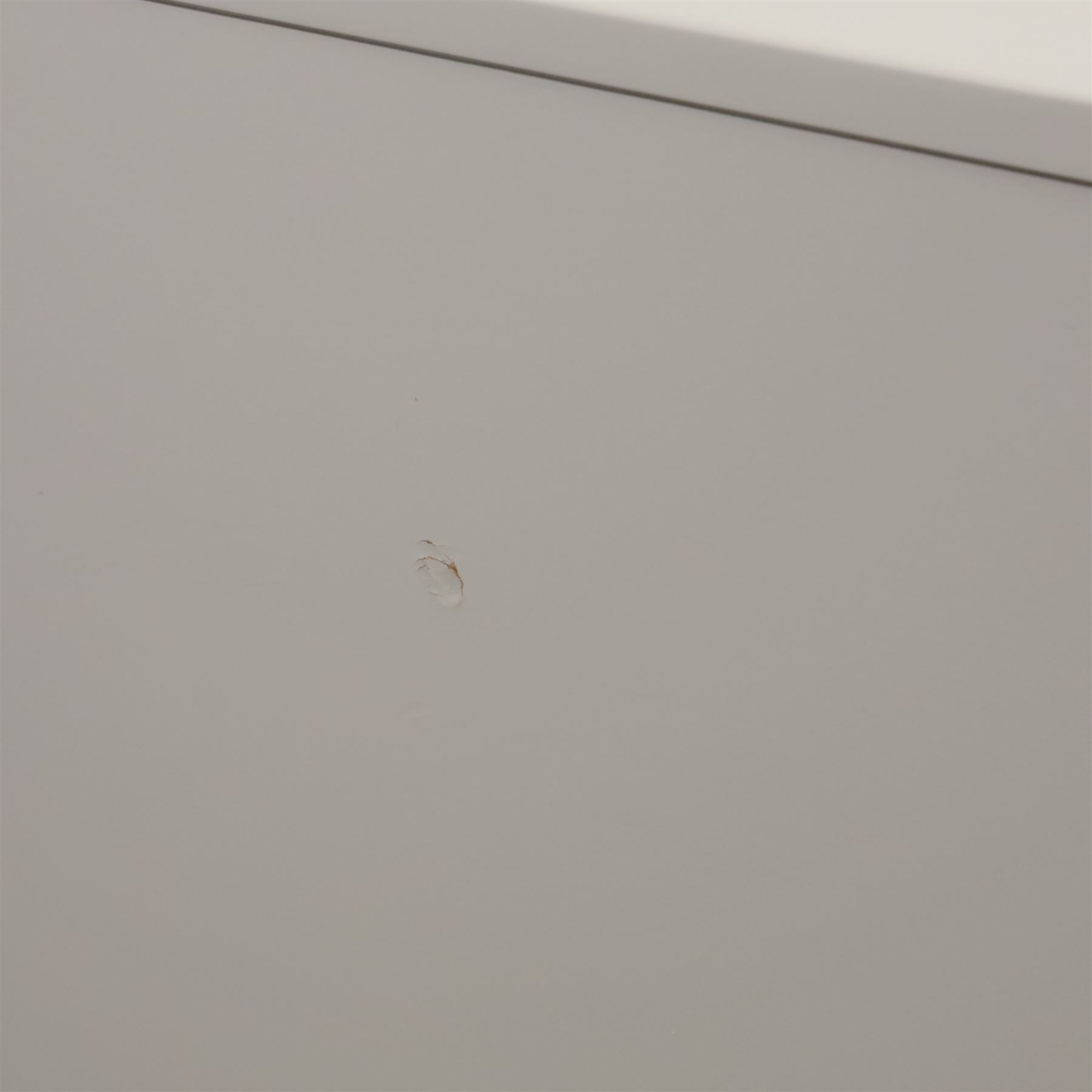 Made.com - 'Ebro' grey four drawer chest, gold painted metal shaped handles, rounded corners with fluted detail, raised on gold painted metal tapered supports