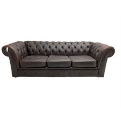 Mid-20th century three seat Chesterfield sofa, upholstered in buttoned chocolate brown leather with studwork border, on castors