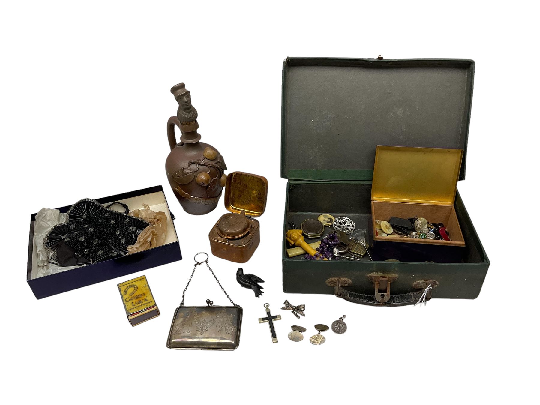 George V silver evening purse, the body of rectangular form with engraved decoration of swags and suspension chain, hallmarked G & C Ltd Birmingham 1918, together with Art Deco black beaded ladies bag (a/f), pair of hallmarked silver cufflinks, hallmarked silver bow brooch, 19th century portable inkwell, Victorian padlock stamped with the crown VR, etc