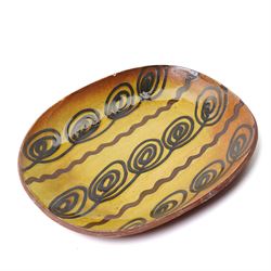 Mick Dixon studio pottery plate, decorate with an owl, impressed marks to base, D27cm; together with slipware dish, impressed BH initials to base, D32cm, a Poole pottery plate and a jug, H25cm (4)