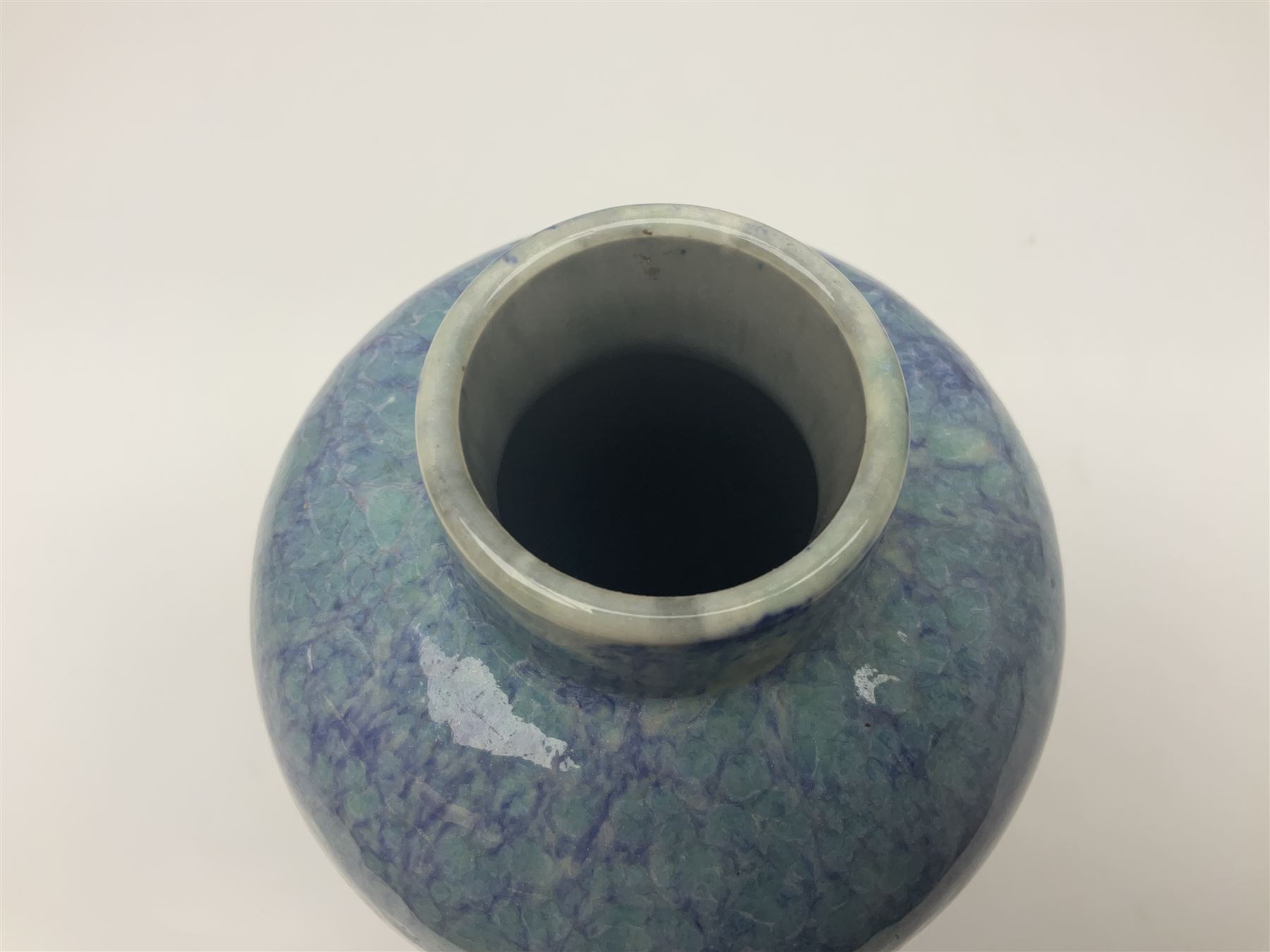 Holyrood Pottery vase of bulbous form decorated in a mottled and streaked green and blue glaze, with printed mark beneath, H24cm
