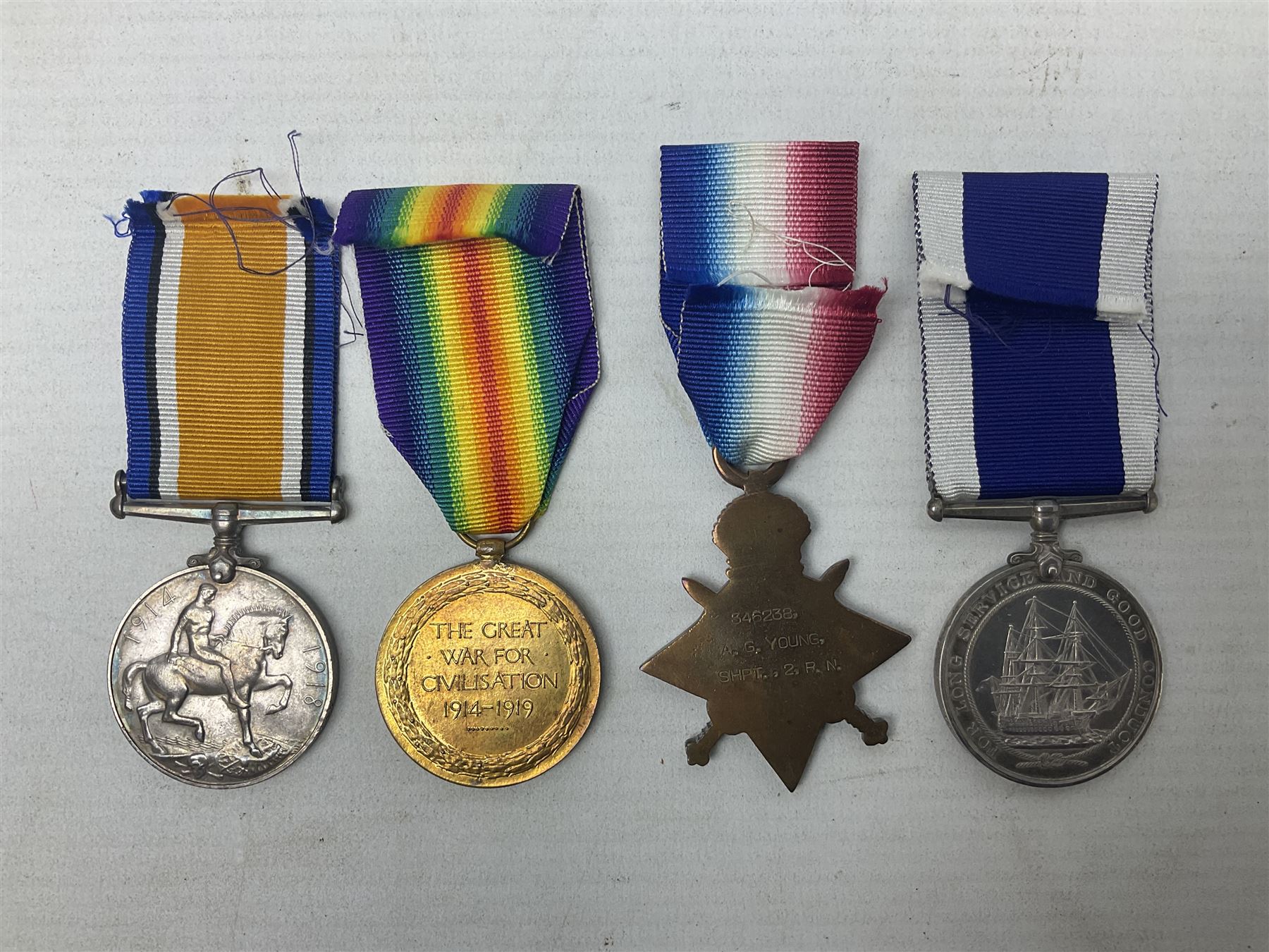 WW1 Naval group of four medals comprising British War Medal, 1914-15 Star and Victory Medal awarded to 346238 A.G. Young SHPT. 2  R.N.; and George V Long Service and Good Conduct Medal awarded to 346238 A.G. Young SHPT. 1 H.M.S. Victory; all with ribbons