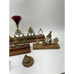 Brass horse terrets, many mounted on wood, including four examples with plumes