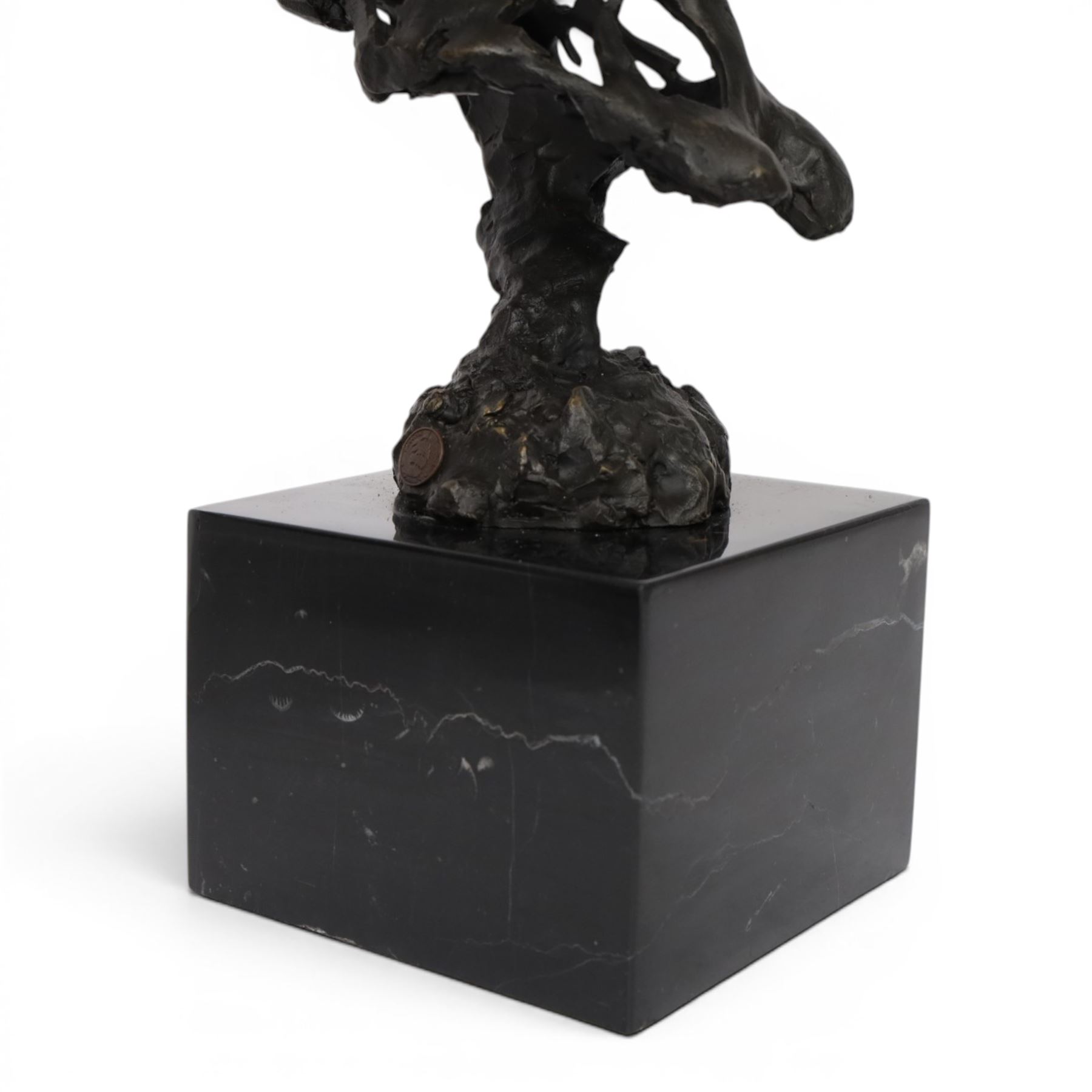 Stylised bronze model of an openwork horses head, signed Gadi and with foundry mark, raised upon black marble plinth, H41cm