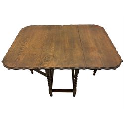 Early 20th century oak barley twist drop leaf gateleg table, pie crust border