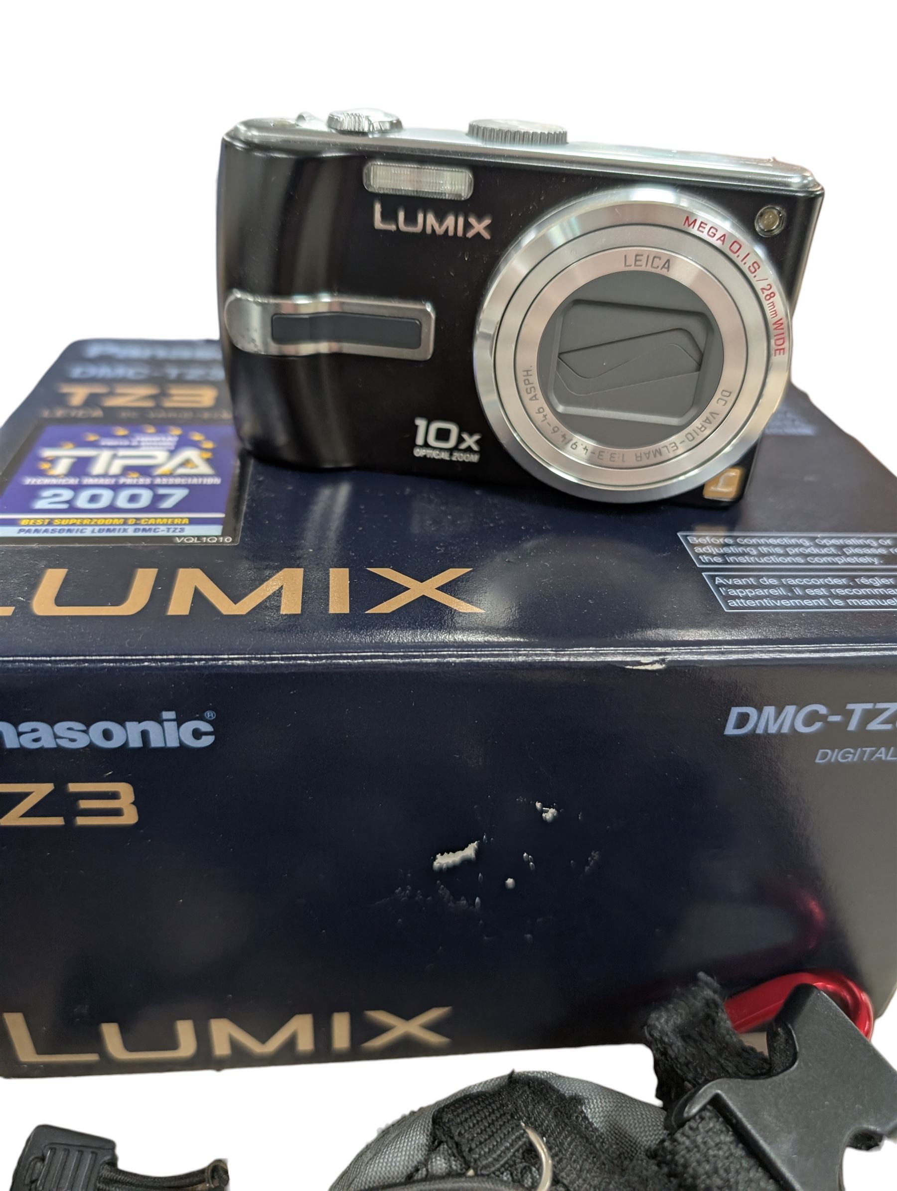 Two compact digital cameras, comprising Panasonic Lumix DMC-TZ3 digital camera, with Leica DC Vario Elmar 1:3.3-4.9/4.6-46 ASPH lens, with carry case, battery, charger, instructions and box and Canon Ixus 400 with carry case and instructions, Manfrotto Professional Tripod and a Benbo monopod