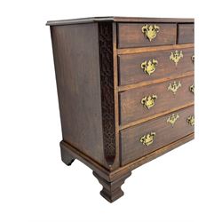 George III Chippendale design mahogany chest, moulded rectangular top with canted corners, wide canted uprights with blind fretwork decoration, two short and three long with moulded fronts, shaped brass handle plates, on ogee bracket feet 
