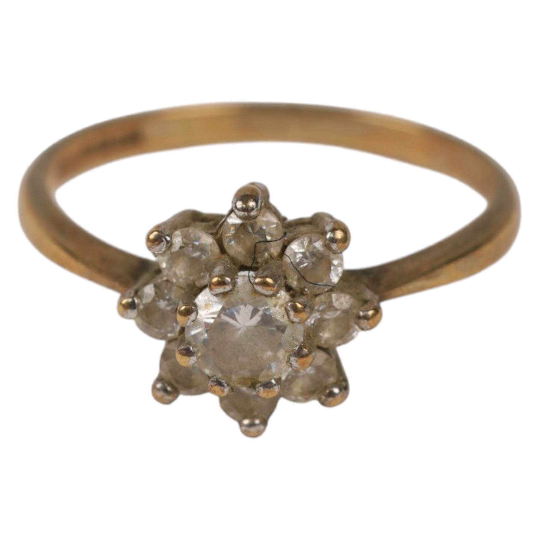 Two 9ct gold rings, including cubic zirconia flower head ring and a signet ring, both hallmarked