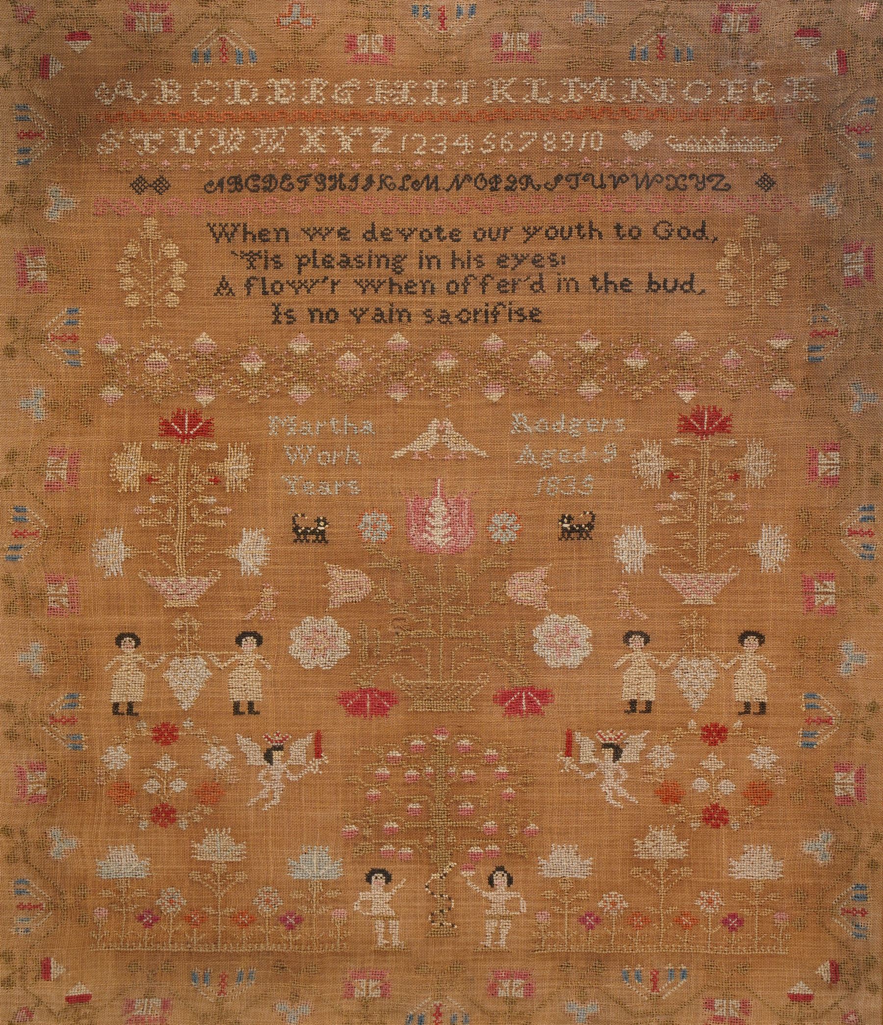 William IV sampler by Martha Badgers aged 9, dated 1835, finely worked with religious verse 'When we devote our youth to God, is pleasing in his eyes; a flow'r when offer'd in the bud, is no vain sacrifice', with decoration depicting Adam, Eve and the Serpent in the Garden of Eden, and other motifs including doves, angels and flowers, 55cm x 48cm 