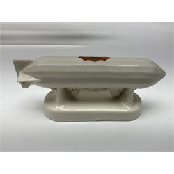 Ten WW1 crested china military models comprising submarine, four ships including Lusitania, four Zeppelins/balloons and an aircraft; various makers including Arcadian China, Swan China, Carlton China, Waterfall, Grafton China etc; various crests including Saint Neots, Great Yarmouth, Tewksbury, Swanage, Simons Town, Hull etc (10)