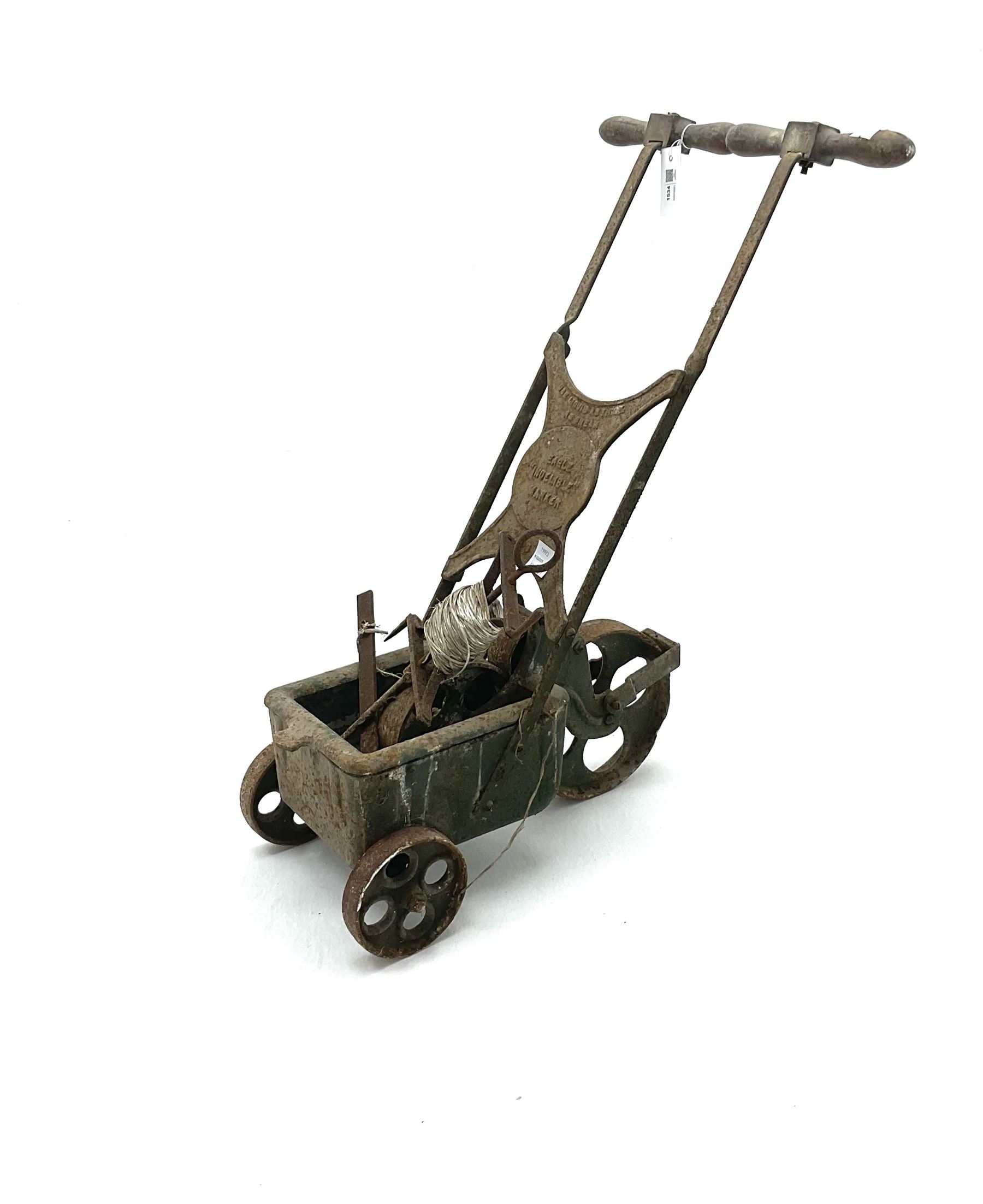 Vintage cast iron tennis court line marker, together with peg and line guide 