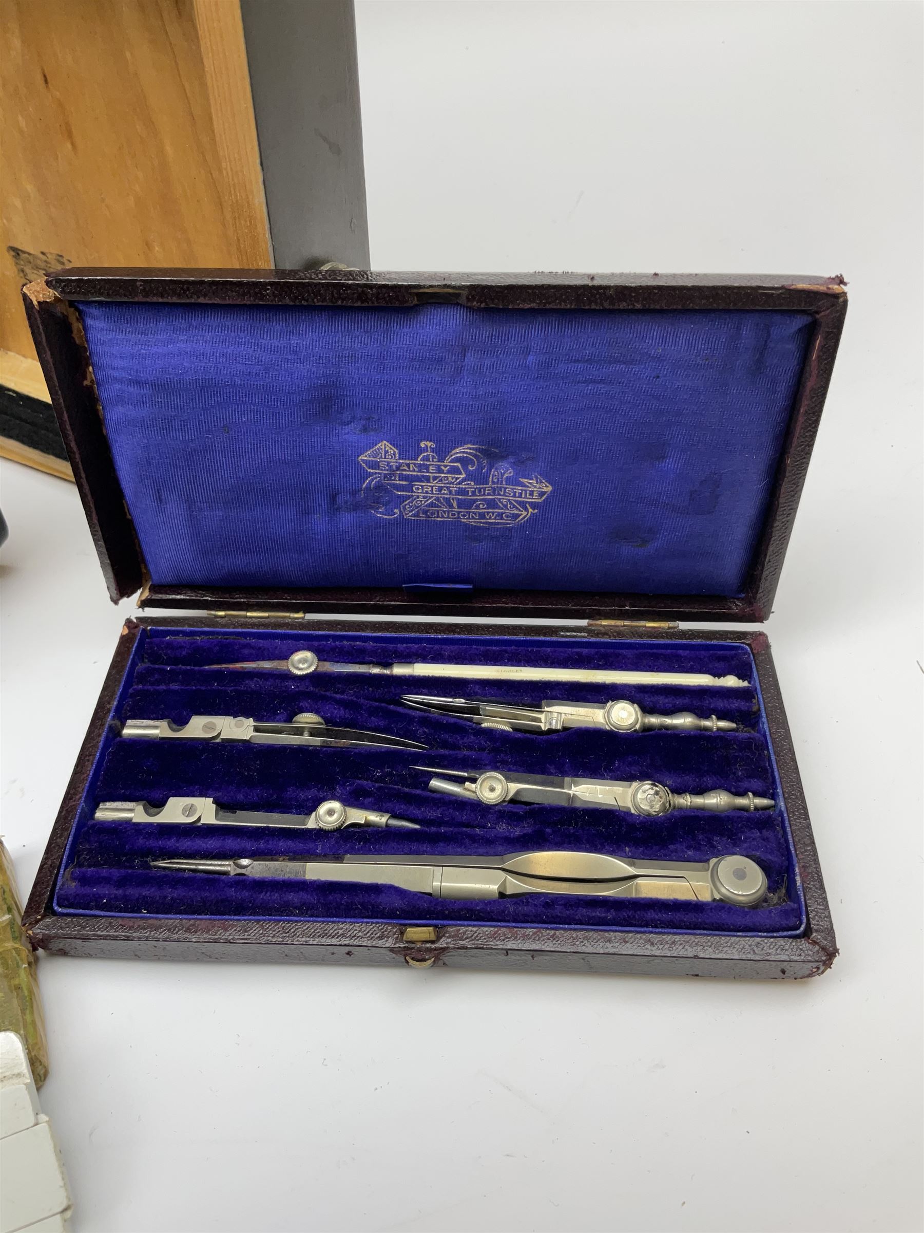 WW2 American Fairchild F-71 binocular magnifying telescope, in green painted wooden carrying box with instruction leaflet L48cm; WW2 Air Ministry Astro Compass Mk.II Ref. 6A/1174(0); Zenith Projection & Camera Lucida Attachment RA-6, boxed with instructions and 1977 purchase invoice; two cased sets of drawing instruments; and a boxed Faber slide rule (6)