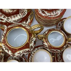 20th century German part tea service decorated in an oriental design with gilt detail, comprising teapot, twin handled covered sucrier, milk jug, eleven cups, twelve saucers, twelve dessert plates and two cake plates (40)