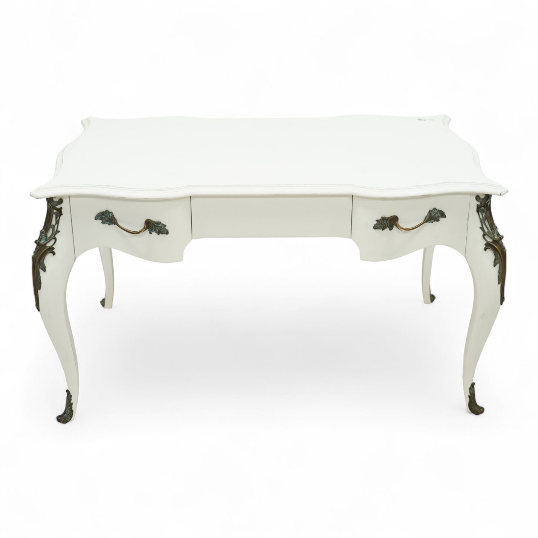 And So To Bed - French design white painted dressing table, serpentine top over two drawers, with decorative mounts and shaped cabriole legs