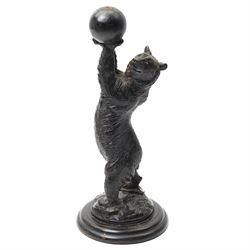 Black forest carving of a circus bear, holding aloft a ball, standing, H35cm