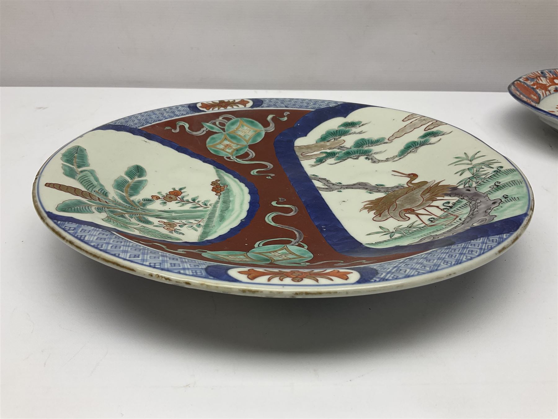 Two 19th century Japanese Imari pattern oval charger together with another circular Imari charger, circular charger D31cm 