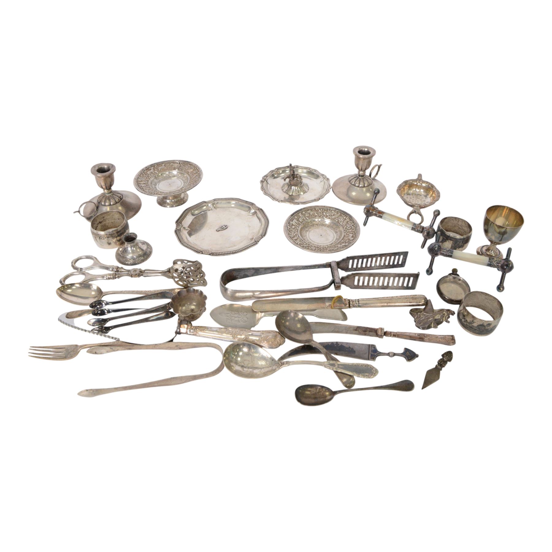 Group of silver, including sugar tongs, christening set, egg  cup, salt, strainer, silver mounted cutlery and Continental silver, together with silver plated items and other metalware 
