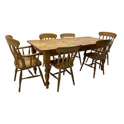Pine farmhouse dining table, rectangular top with rounded corners, raised on turned supports; together with a set of six (4+2) spindle-back dining chairs