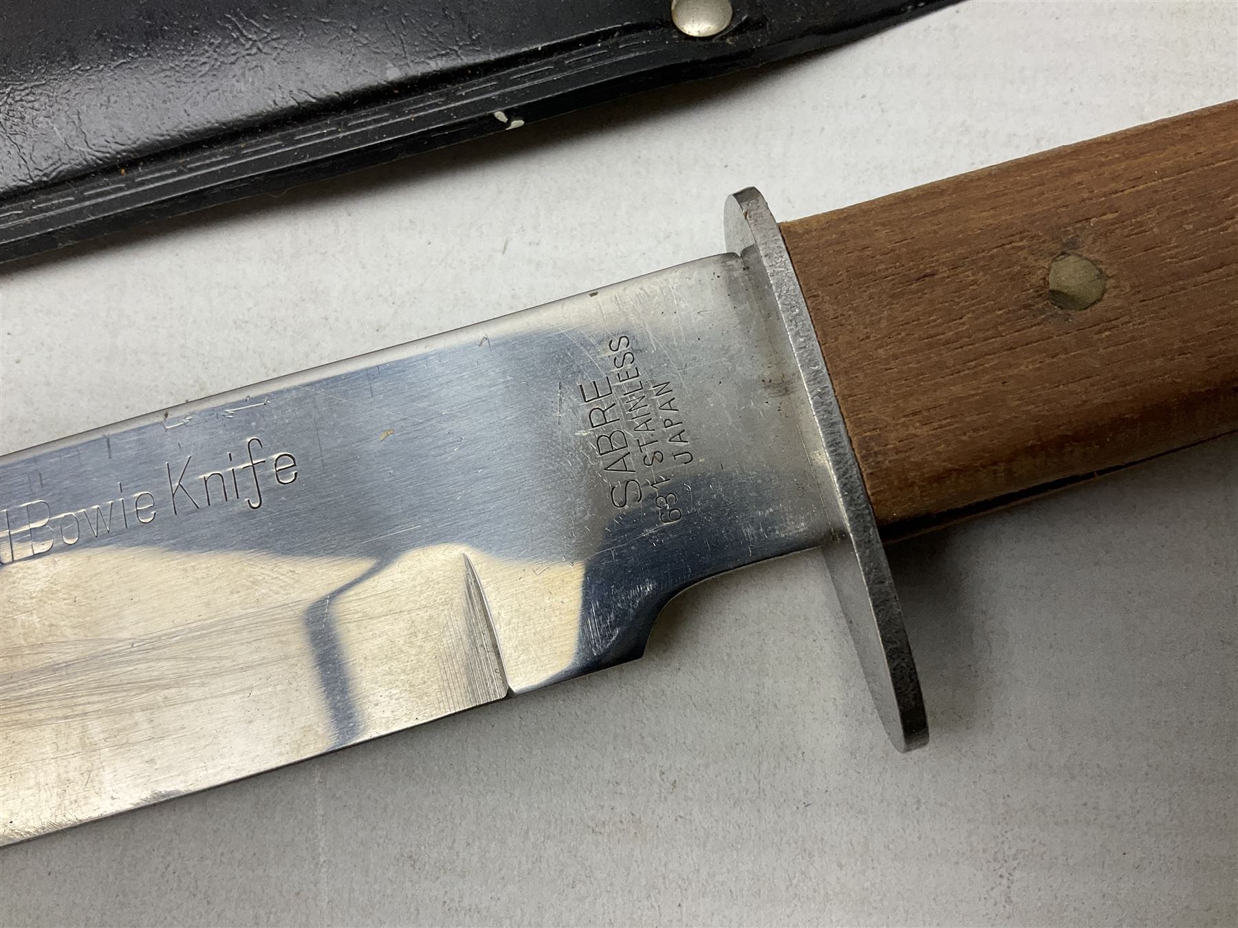 Reproduction non-firing flintlock pistol with brass skull crusher butt, the lock-plate inscribed 'Tower' and 'GR' L40cm; Sabre Japan Original Bowie Knife in sheath; and Indian embossed nickel two-piece walking cane (3)