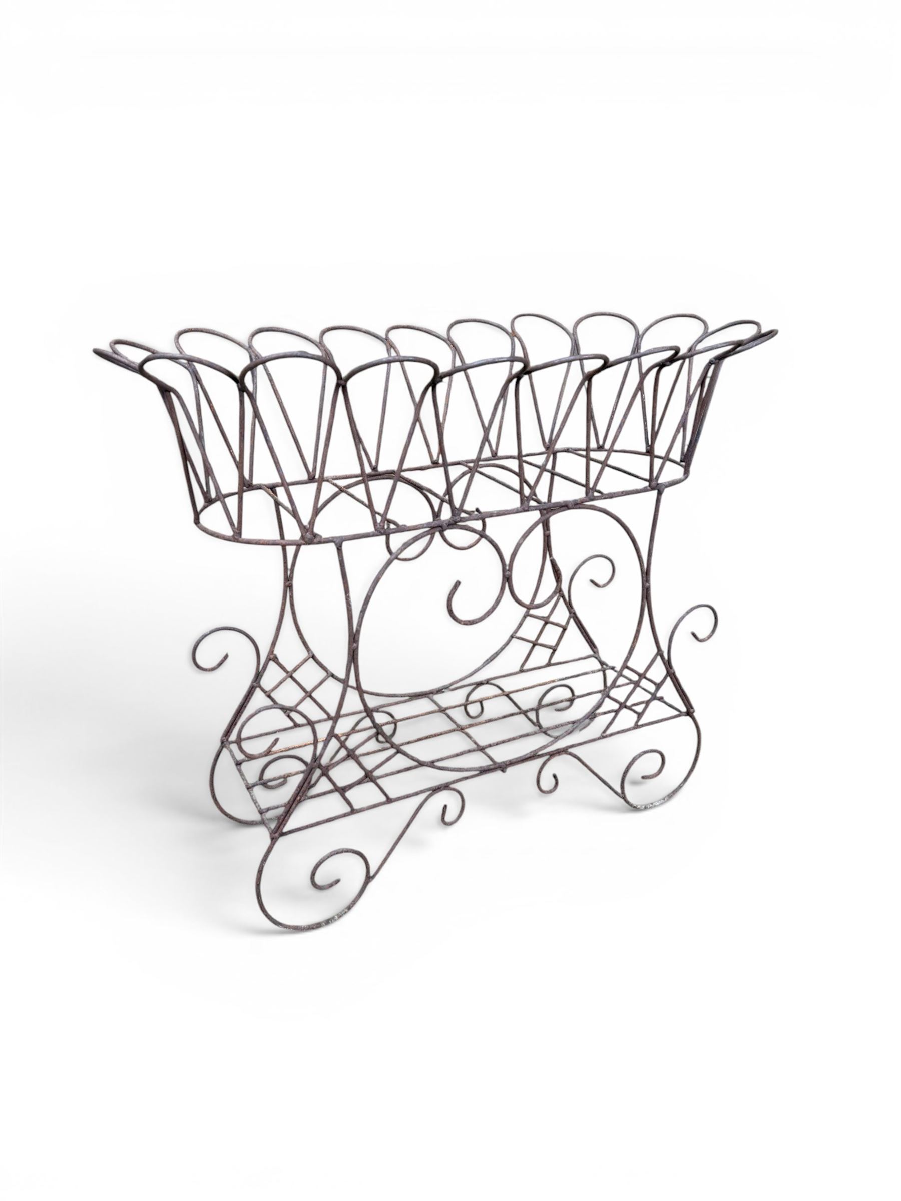 Mid-20th century wirework garden planter, oval form with heart shaped centre, under-tier shelf above scrolling feet