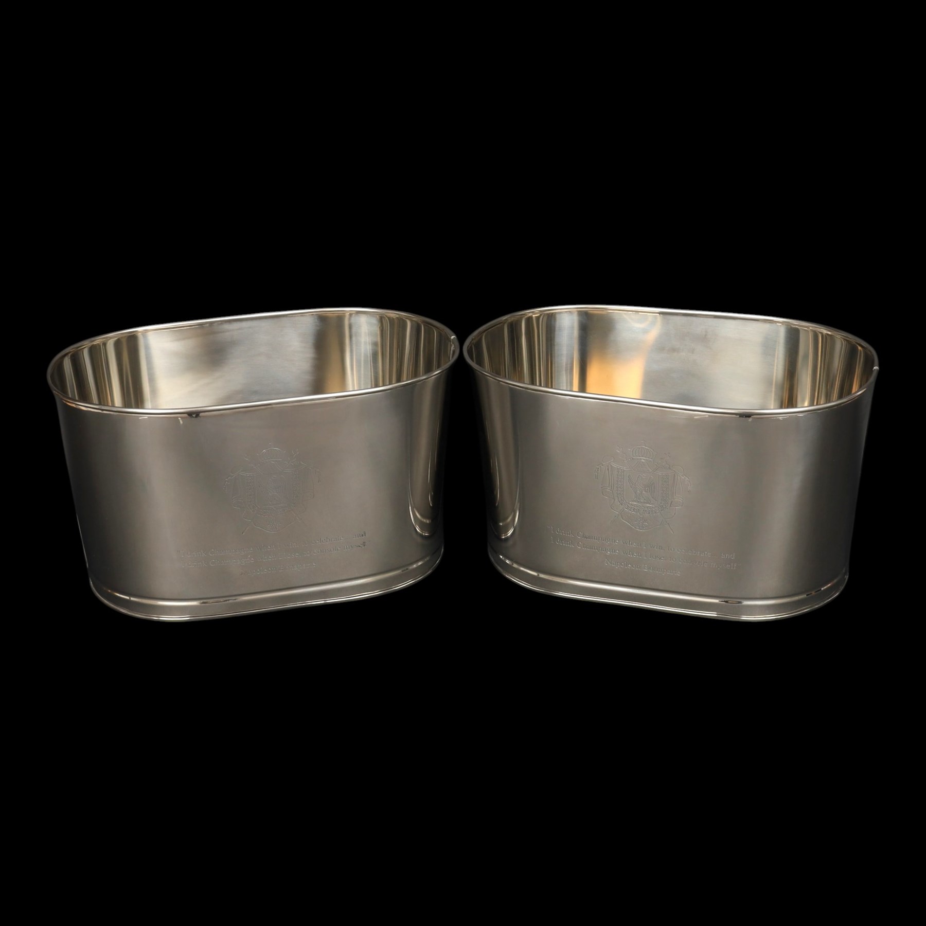 Pair oval champagne coolers, engraved 'I drink champagne when I win to celebrate ... and I drink champagne when I lose to console myself' H25cm, L43cm 