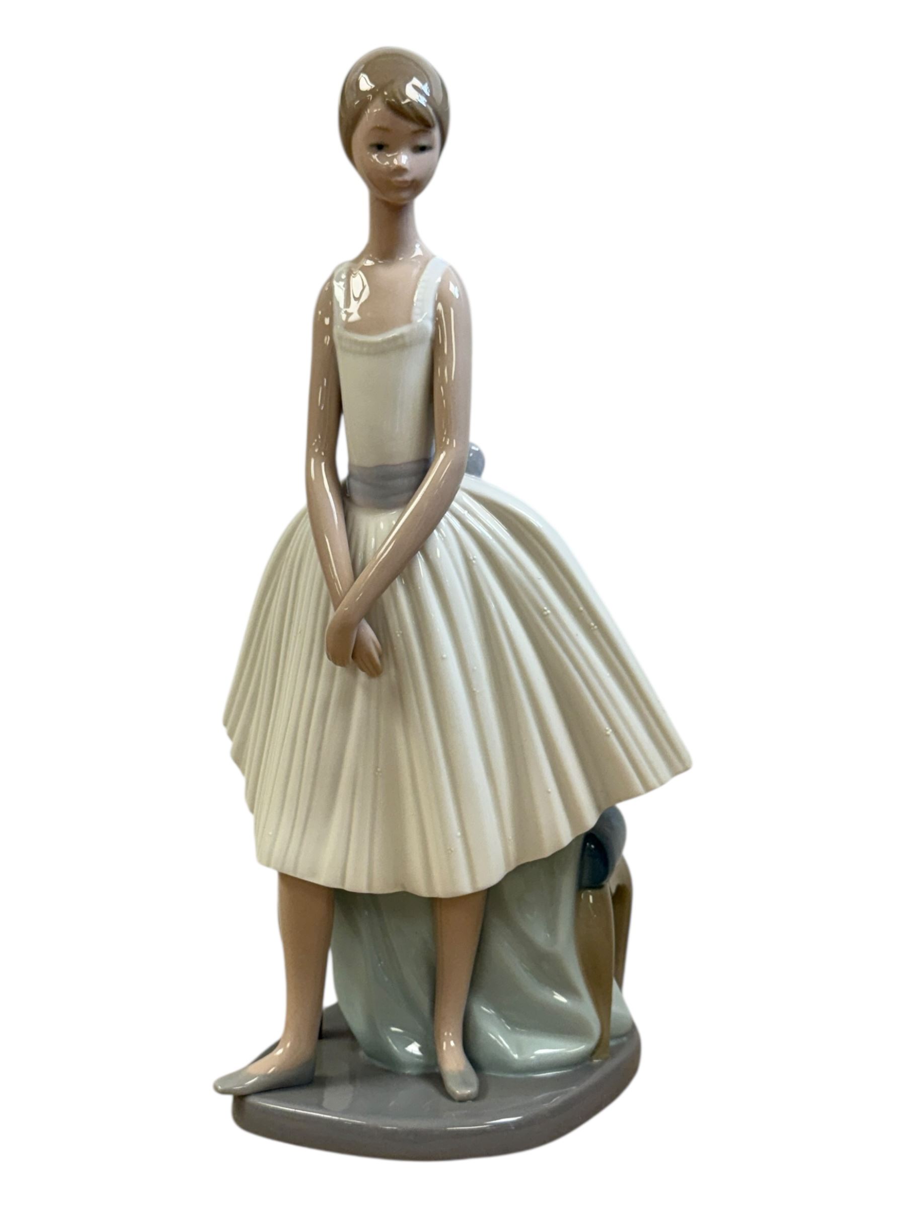 Three Lladro figures, Bashful Bather 5455, Pepita no 5372 and girl with lamb no 1010, together with two Neo figures and a Royal Doulton figure 