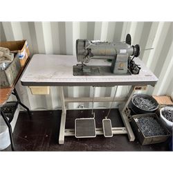 Singer industrial sewing machine on tabl