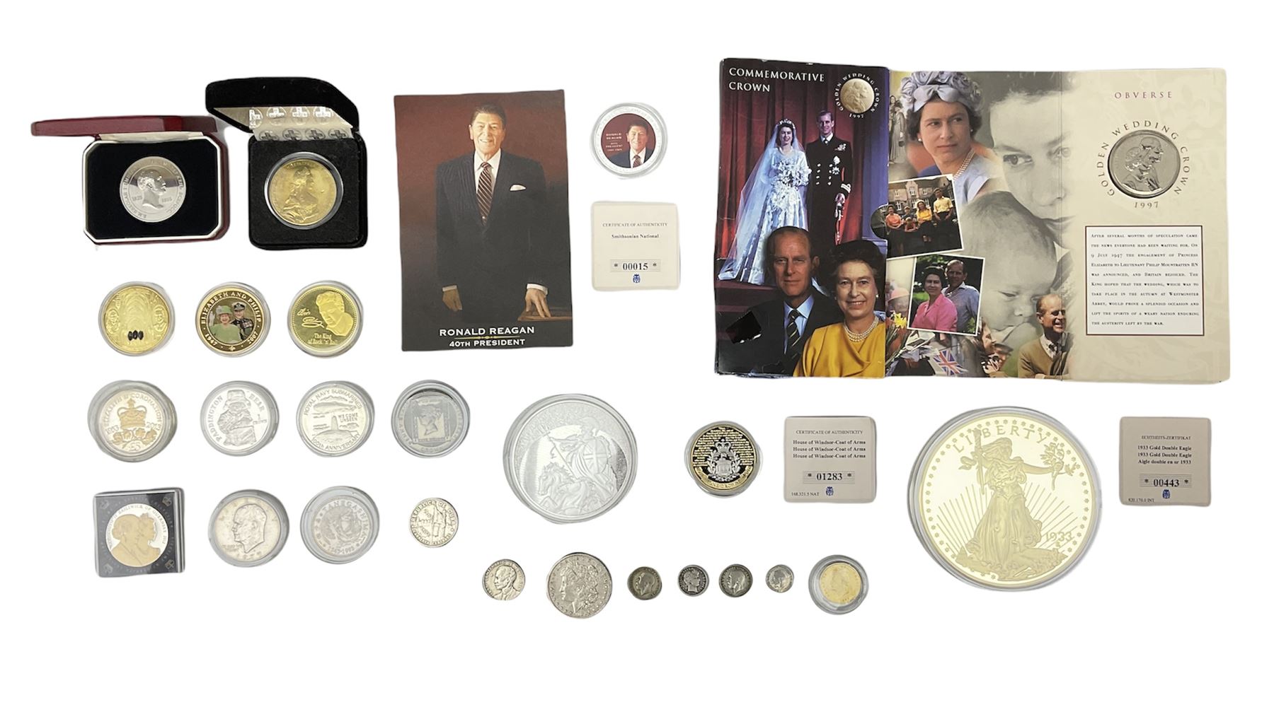 Coins including United States of America 1885 Morgan dollar, Queen Elizabeth II Bailiwick of Guernsey 20012 and 2013 five pound coins, Isle of Man Paddington Bear 2008 one crown, various other commemorative coins etc