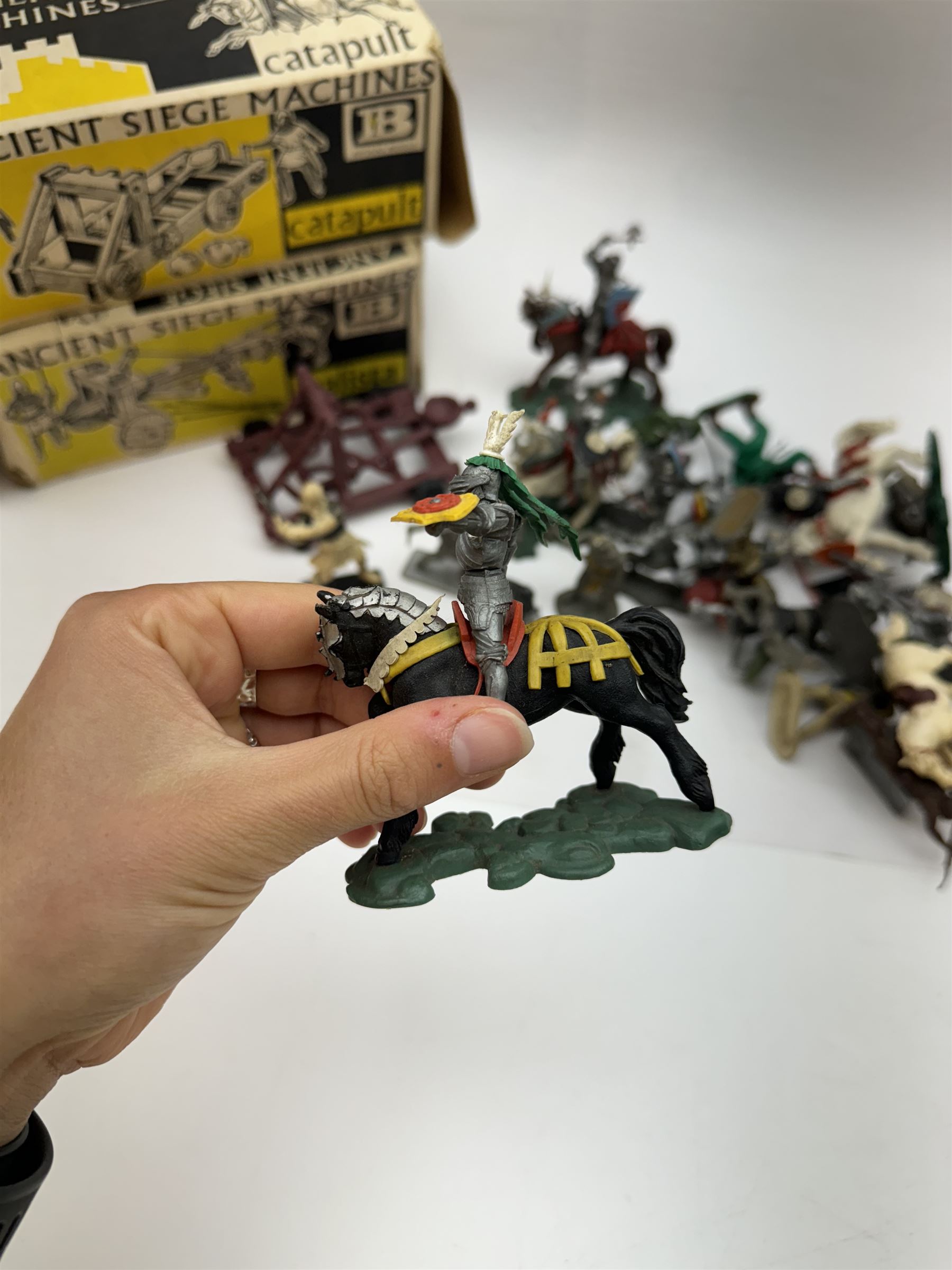 Two Britain's Ancient Siege Machines, comprising Balista and Catapult and a collection of plastic knights and soldiers, including Britains examples etc