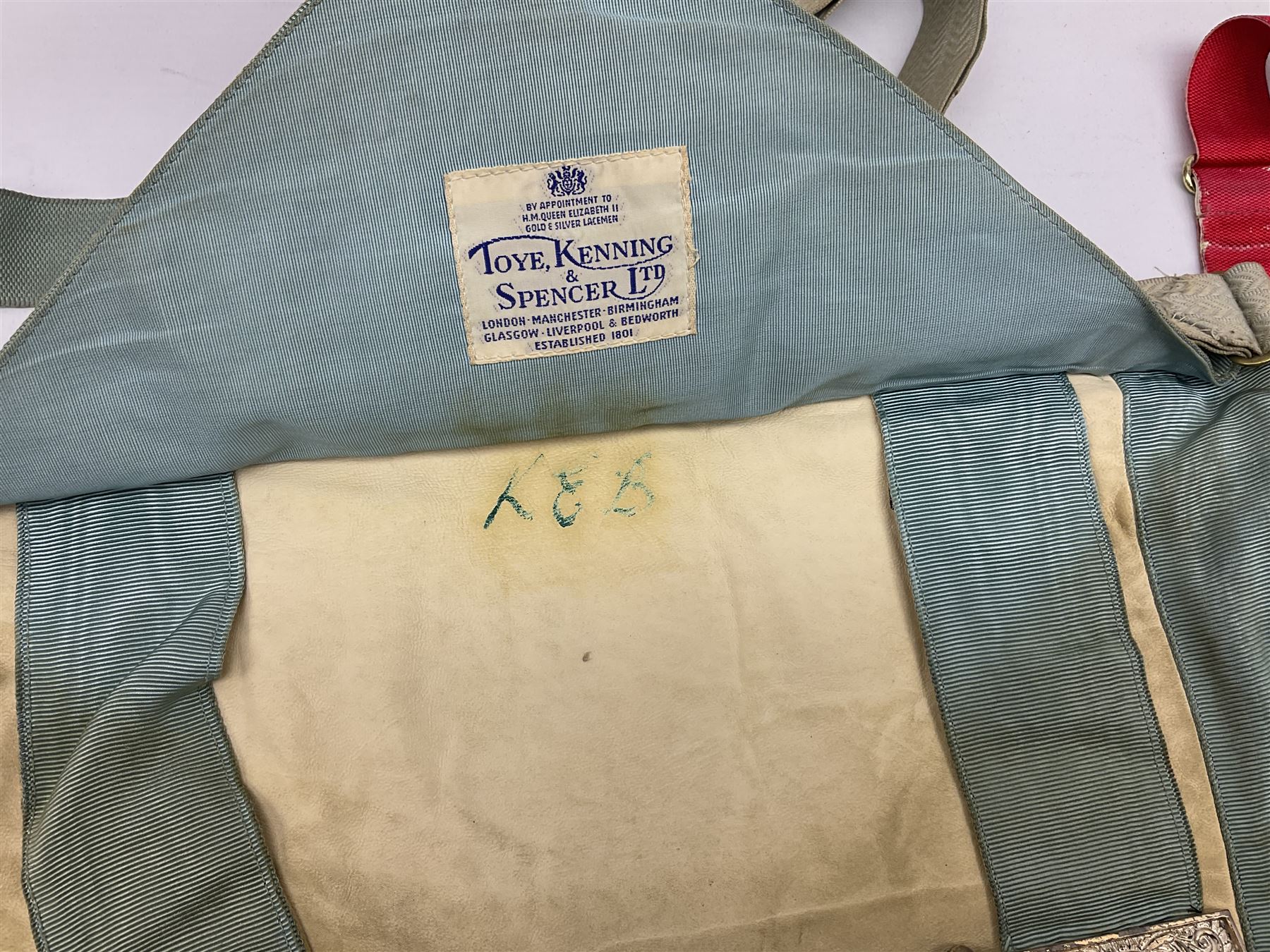Two Masonic kid leather aprons, one with sash and cuffs, the other with sash, each marked 'Yorkshire North and East Ridings'; and three other unmarked Masonic aprons with sashes