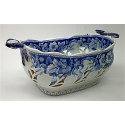 Mid 19th century blue and white transfer printed pearlware reticulated chestnut basket, of oval form with twin handles, decorated to the interior with figures before a classical temple within a garden setting, including handles W26cm, together with a mid 19th century blue and white transfer printed pearlware stand with reticulated edge, decorated with a Willow Pattern, L25cm, and a John and William Ridgeway blue and white transfer printed twin handled pierced basket, decorated with a pastoral scene containing figures at work, with printed mark beneath, including handles L25cm