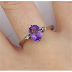 Early 20th century three stone oval amethyst and diamond chip ring, stamped 18ct Plat