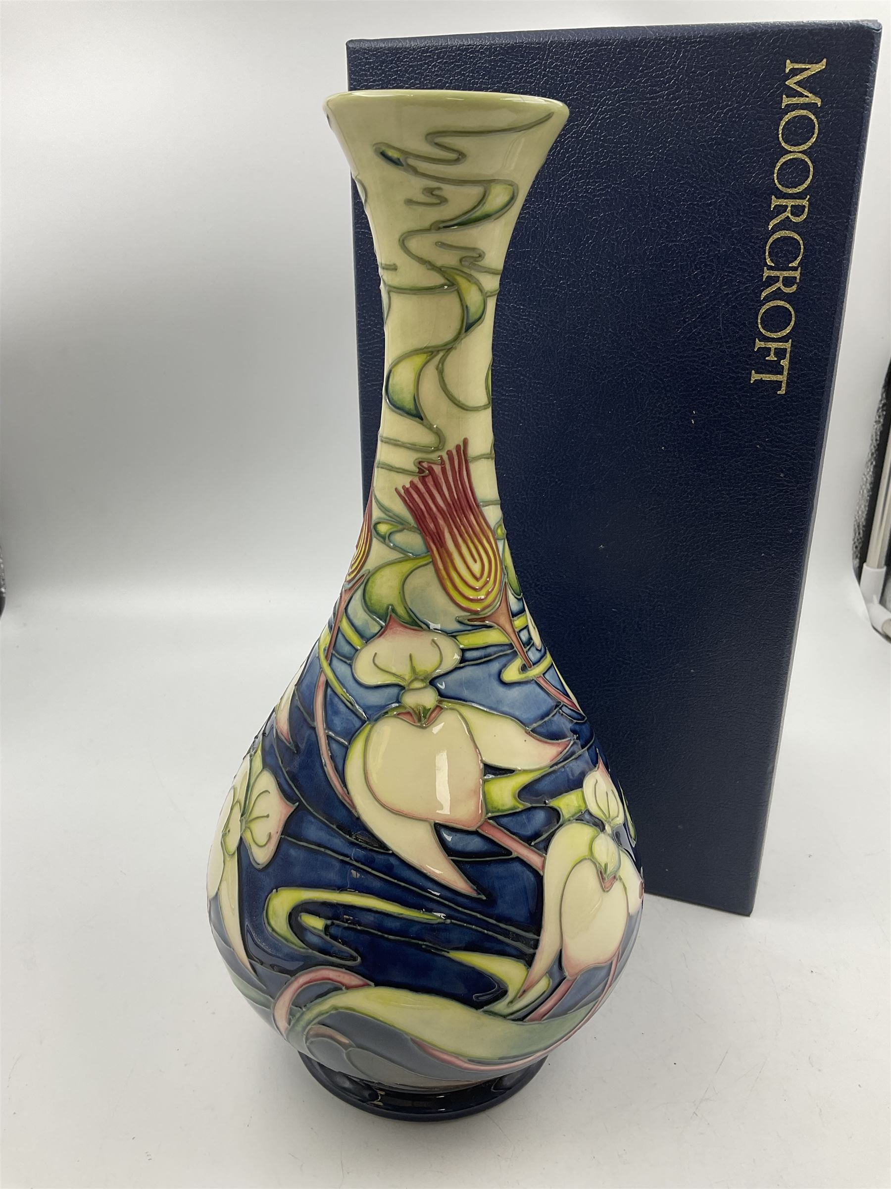 Moorcroft vase, of bottle form, decorated in the Orchid Arabesque pattern by Emma Bossons, circa 2002, H31.5cm, with original box 