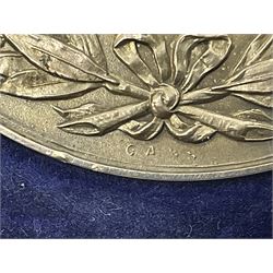 Charles I 1625 hammered silver sixpence, Queen Victoria 1894 crown coin and a cased hallmarked silver medal for the Hull photographic society, engraved '1940' 'Leonard Vokes', all housed in a red Pobjoy Mint coin box