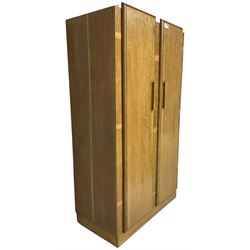 Early 20th century Art Deco period oak Gentleman's wardrobe, the interior fitted with shelves, hanging rails and two long drawers