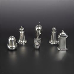 Group of silver cruets, including a pair of Edwardian conical shaped salt and pepper shakers and four other salt/pepper shakers, all hallmarked 
