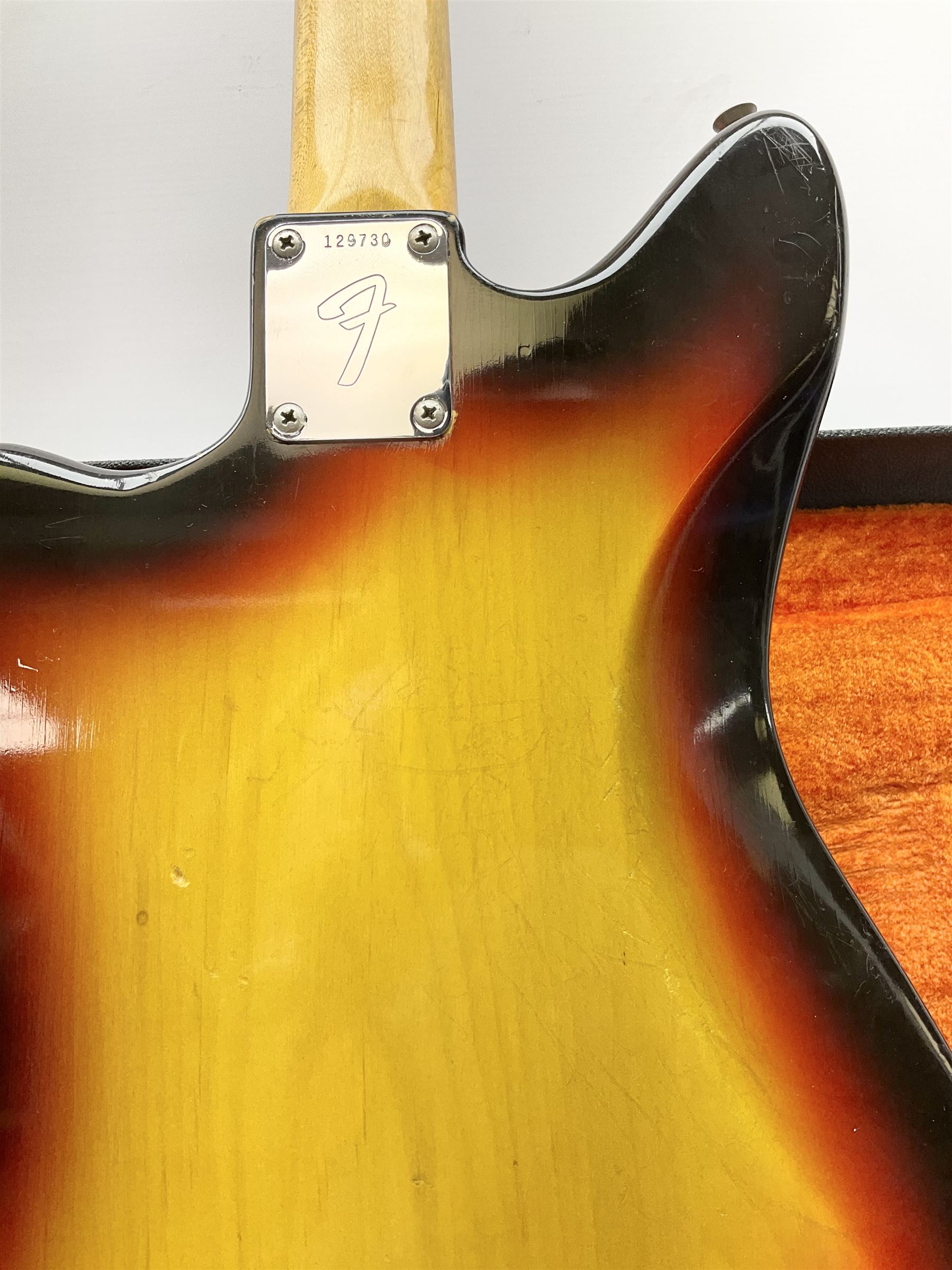 Fender three-tone Sunburst 12-string electric guitar c1965/6 Fullerton USA, with alder body and maple neck, the Indian rosewood fretboard with twenty-one frets and pearloid dot markers, fender electric XII bridge, F-stamp tuners (non-original), two split single coil pick-ups, master volume and tone and four-way switch, serial no.129730, L108cm; in original Fender case bearing label for Rivington Guitars New York with copy of original invoice; together with GuitarKes set-up and service certificate dated October 2021
