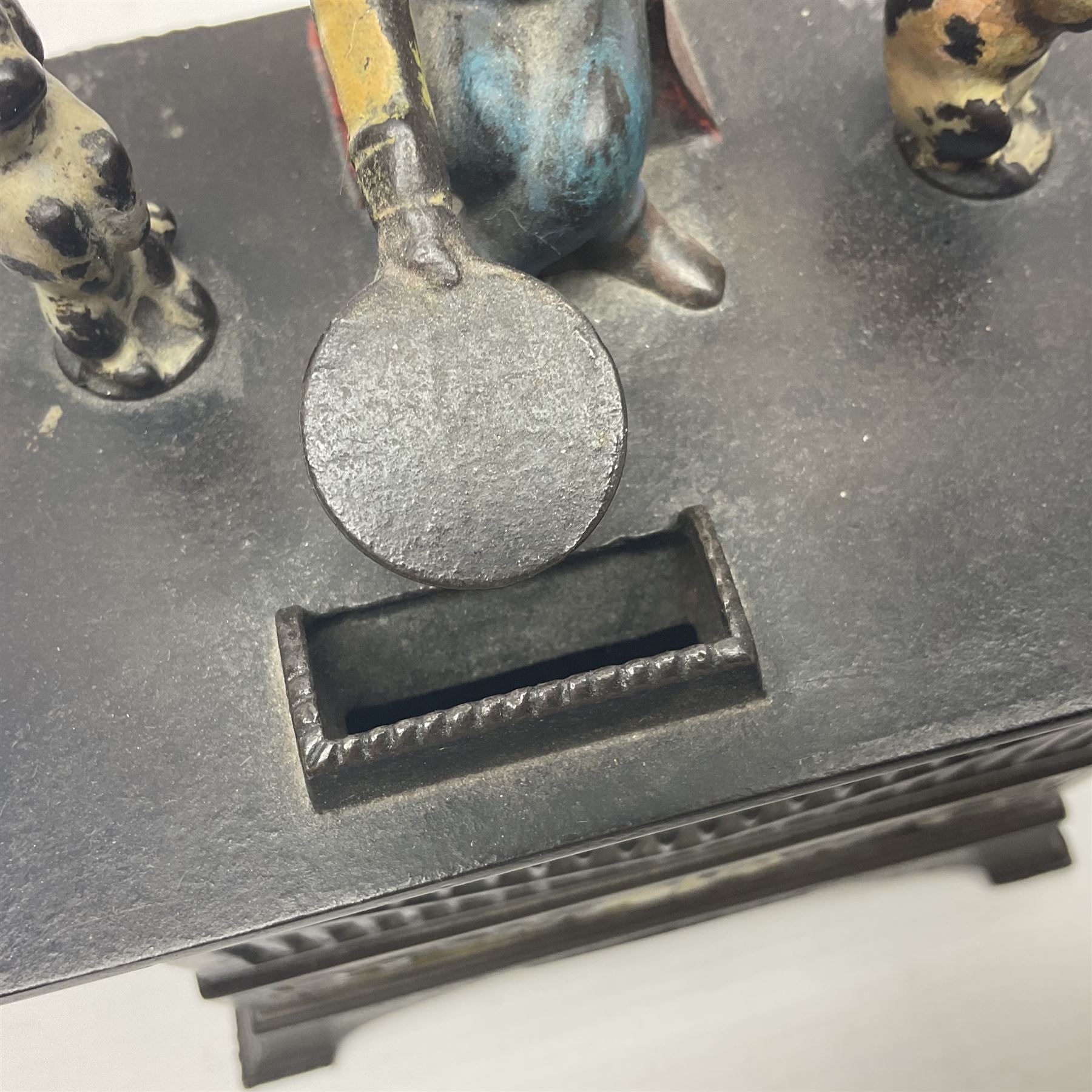 American 'Organ Bank' musical cast-iron mechanical money bank with hand cranked action and seated figure with two dancing dogs on top; locking door to base (no key); marked to the back 'Pat June 13 1882', H19cm