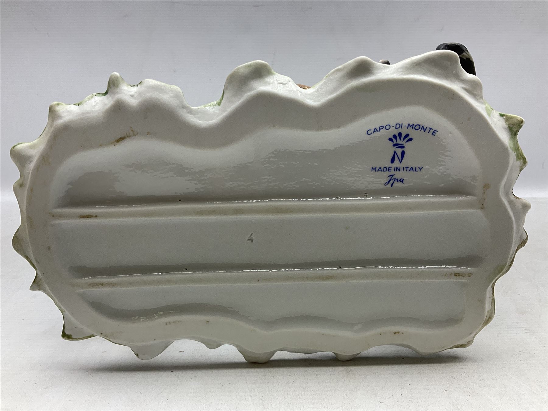 Two Capodimonte figures, comprising The Watchmaker by Curiase and Tramp Seated on a Bench, created by D.Bonalberti, tallest example H24cm