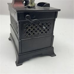 American 'Organ Bank' musical cast-iron mechanical money bank with hand cranked action and seated figure with two dancing dogs on top; locking door to base (no key); marked to the back 'Pat June 13 1882', H19cm