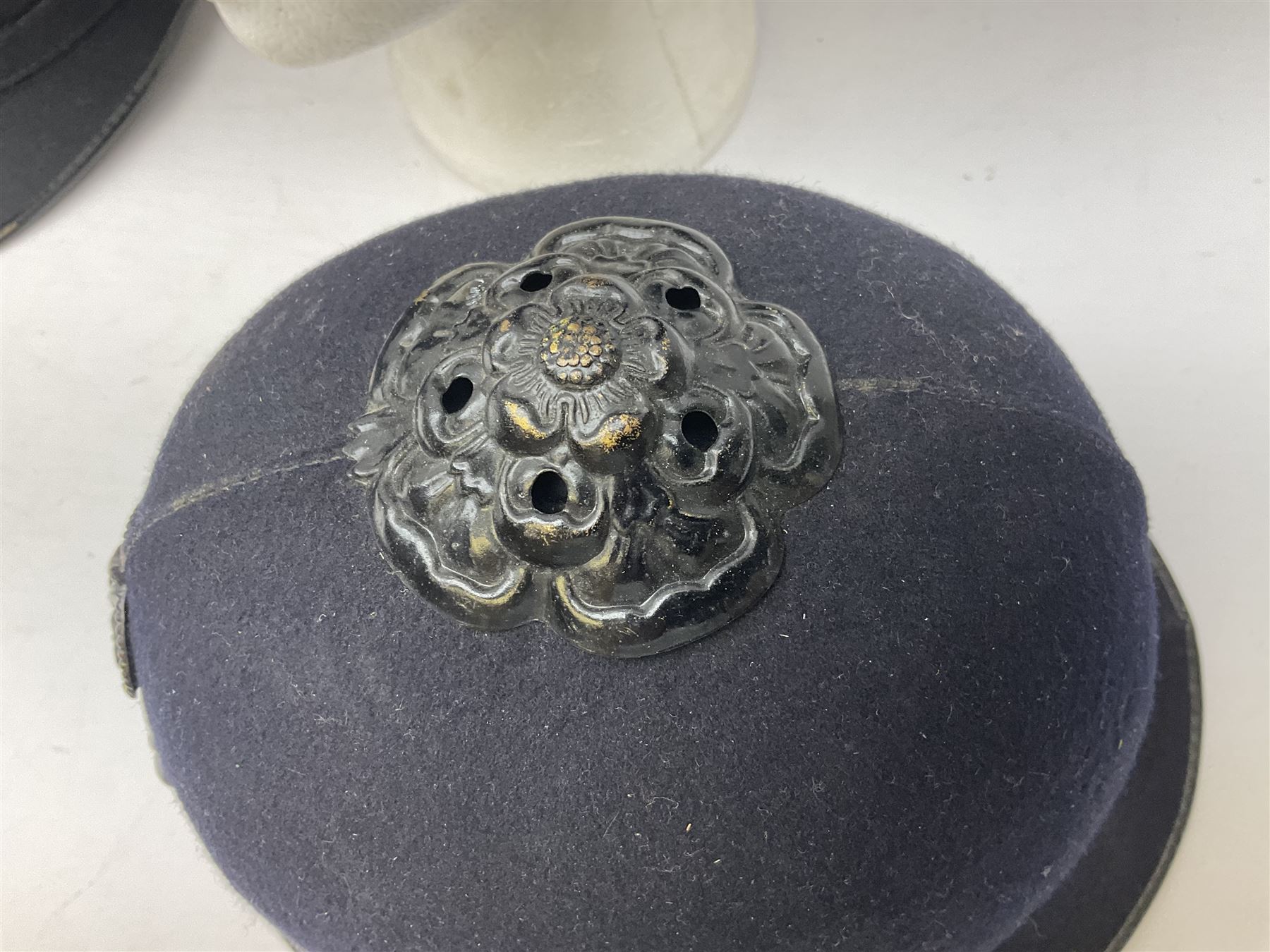 Hull City Police - helmet with king's crown night plate; two further ball-top helmets with Queen's crown plates; and a peaked cap (4)