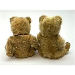 Chiltern Ting-a-Ling teddy bear c1950s with blond mohair body, swivel jointed head with glass eyes and vertically stitched nose and mouth, jointed limbs with velvet pads and card lined feet and internal chimes H14